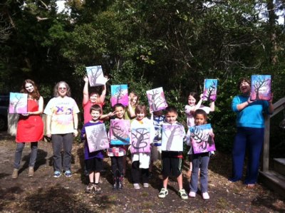 Apprentice helper Zoe Huppert (left) poses with Kitty Mitchell (second from left), the kids, and Katy Mitchell (right.) 